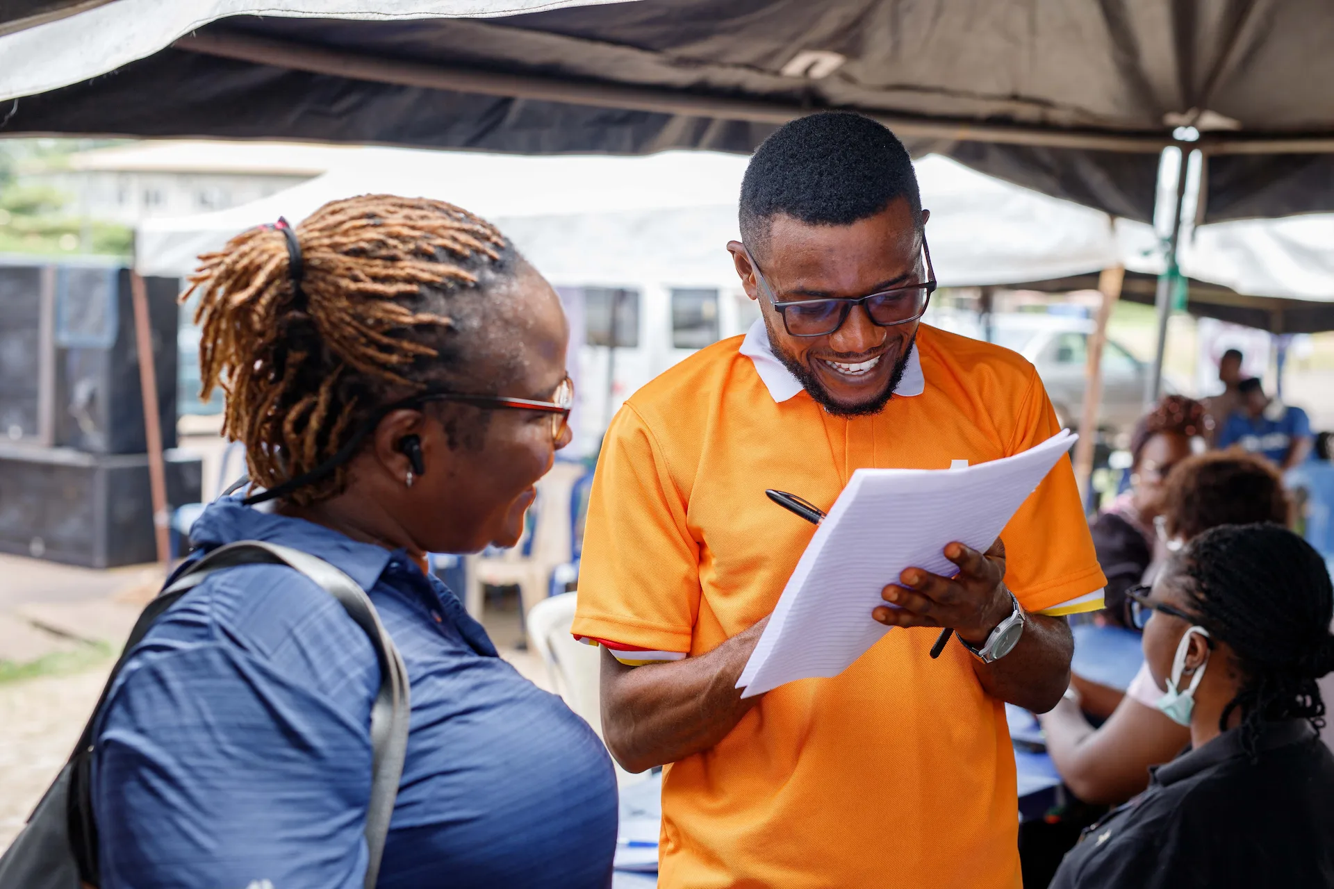 A clinician consulting with a patient